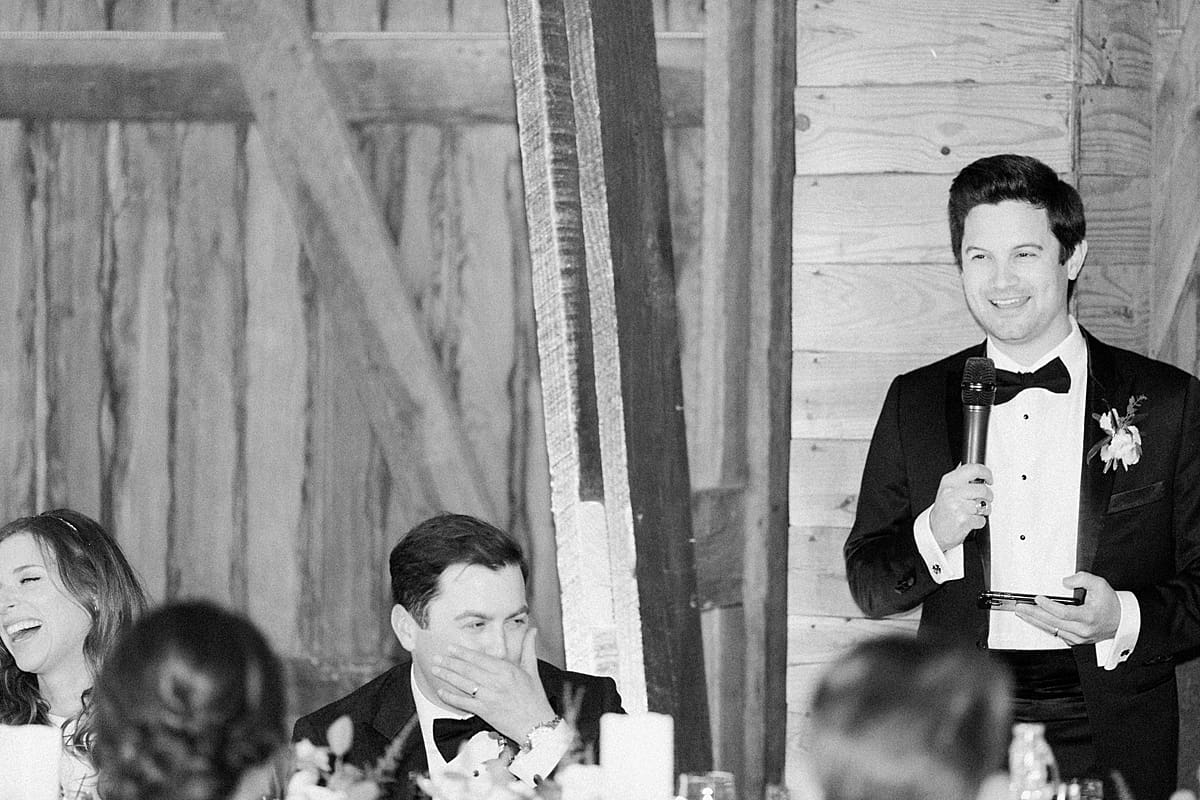 Arielle Peters Photography | Bride and groom laughing at wedding reception on wedding day at St. Joseph's Farm in Granger, Indiana.