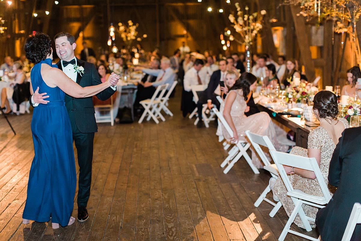  Arielle Peters Photography | Mother of groom and groom sharing a dance at wedding reception on wedding day at St. Joseph's Farm in Granger, Indiana.
