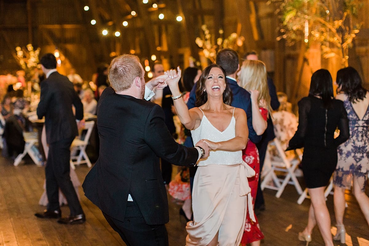  Arielle Peters Photography | Wedding guests dancing at wedding reception on wedding day at St. Joseph's Farm in Granger, Indiana.