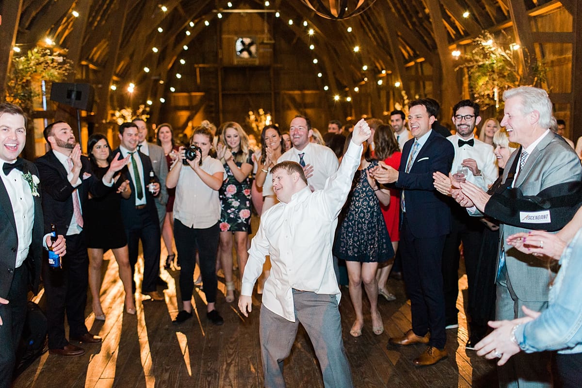  Arielle Peters Photography | Wedding guests dancing at wedding reception on wedding day at St. Joseph's Farm in Granger, Indiana.
