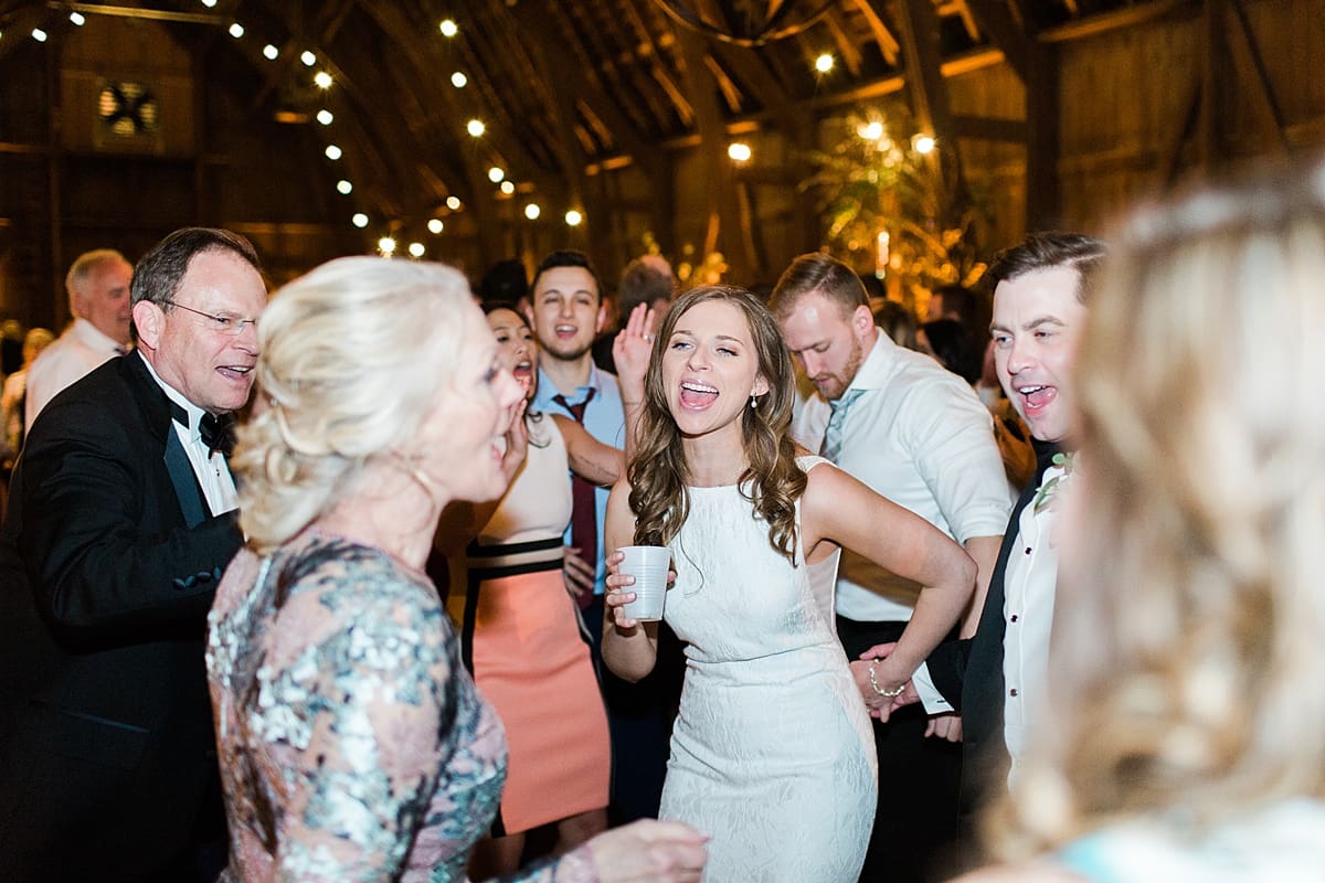  Arielle Peters Photography | Bride and groom dancing at wedding reception on wedding day at St. Joseph's Farm in Granger, Indiana.