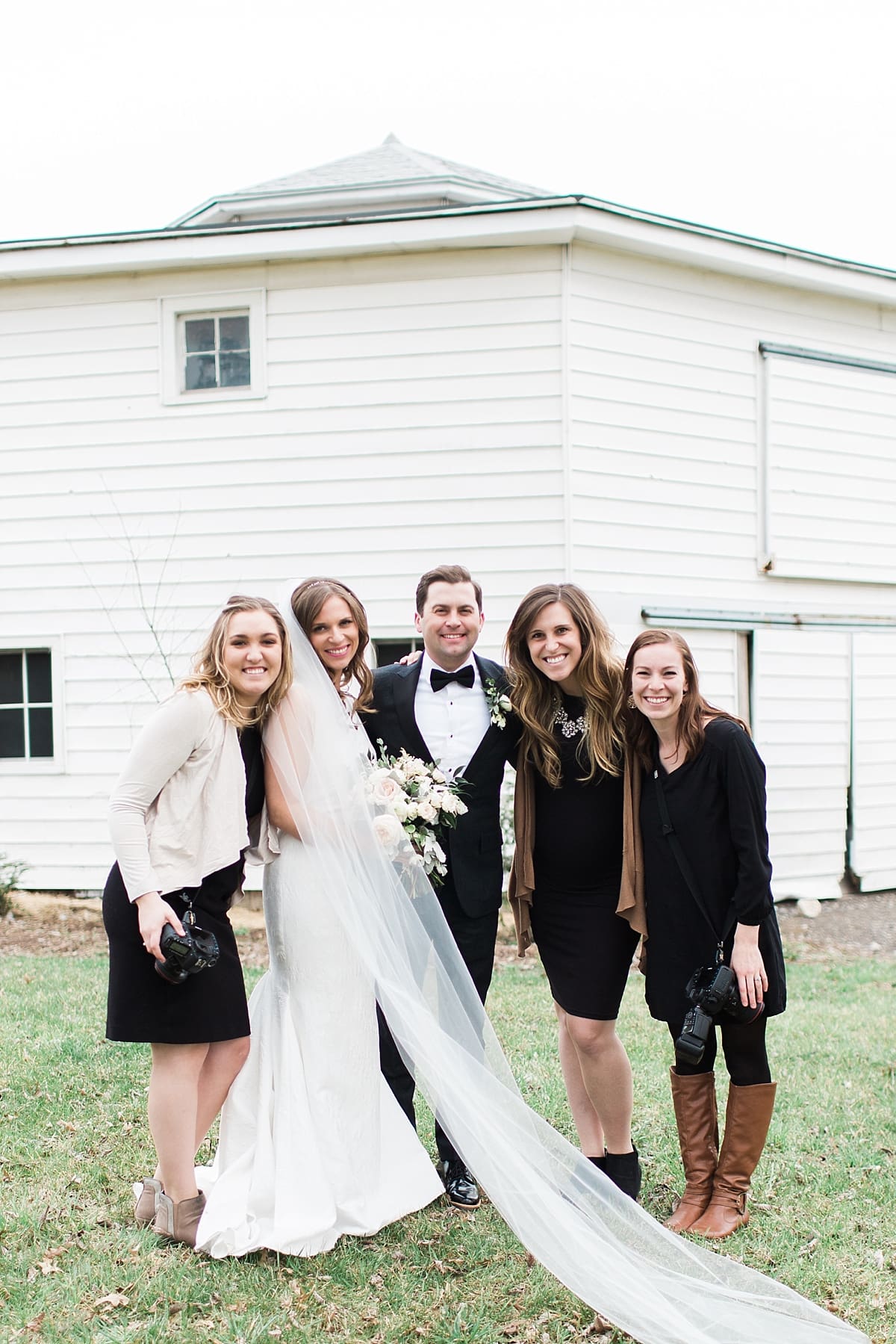  Arielle Peters Photography | Bride and groom outside barn on wedding day at St. Joseph's Farm in Granger, Indiana.