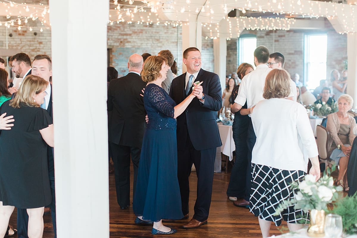Arielle Peters Photography | Wedding guests dancing at wedding reception on wedding day at Bread & Chocolate in Goshen, Indiana.