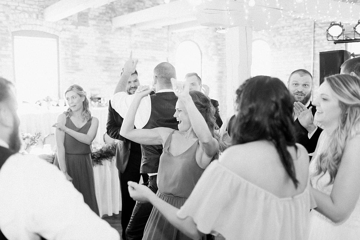 Arielle Peters Photography | Wedding guests dancing at wedding reception on wedding day at Bread & Chocolate in Goshen, Indiana.