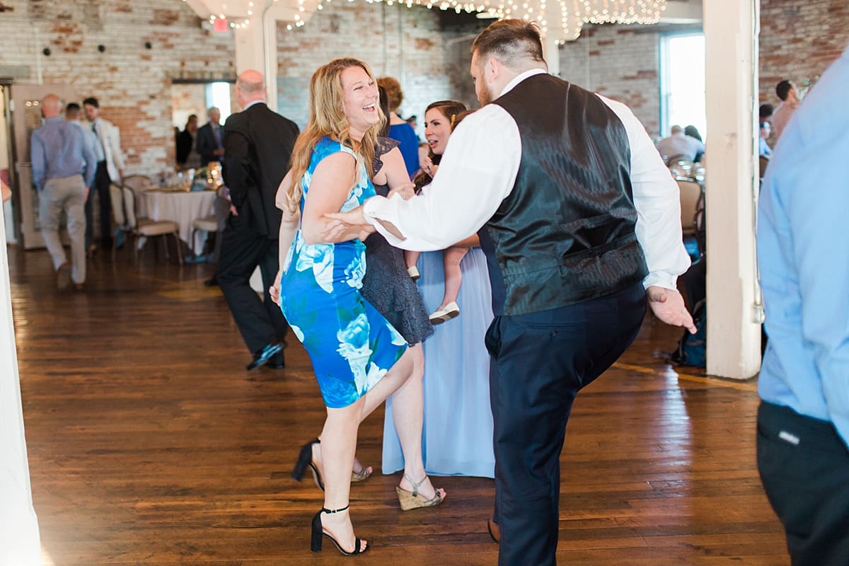 Arielle Peters Photography | Wedding guests dancing at wedding reception on wedding day at Bread & Chocolate in Goshen, Indiana.