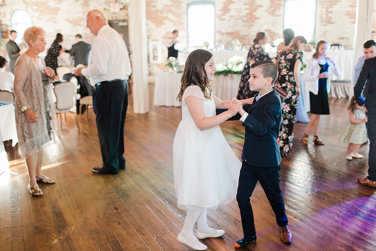 Arielle Peters Photography | Wedding guests dancing at wedding reception on wedding day at Bread & Chocolate in Goshen, Indiana.
