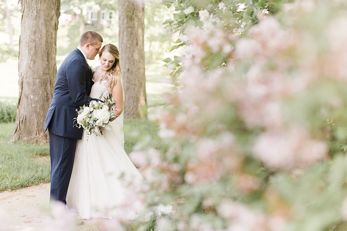 Arielle Peters Photography | Bride and groom under tunnel of trees on wedding day in Winona Lake, Indiana. 