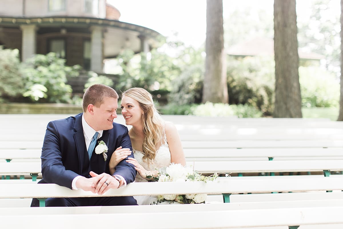 Arielle Peters Photography | Bride and groom sitting on benches at home on wedding day in Winona Lake, Indiana. 