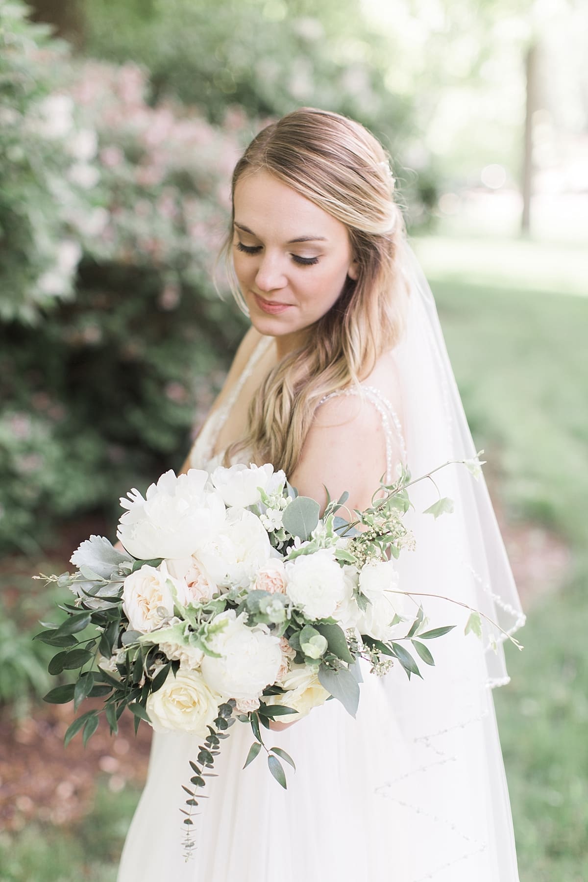 Arielle Peters Photography | Bride under large trees at home on wedding day in Winona Lake, Indiana. 
