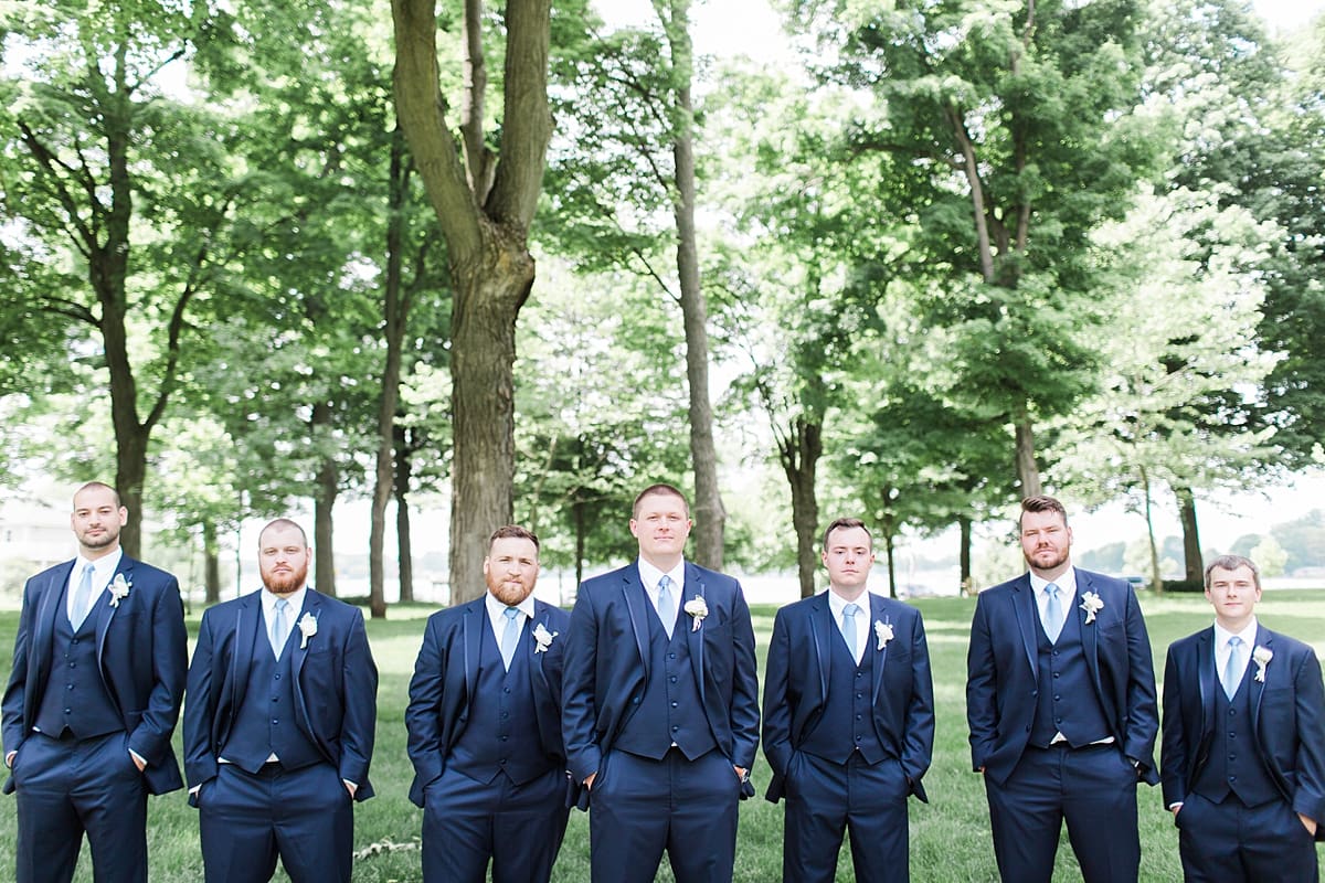 Arielle Peters Photography | Groom and groomsmen under large trees at home on wedding day in Winona Lake, Indiana. 
