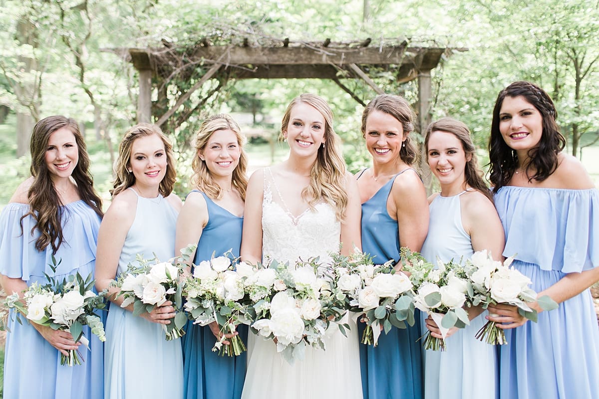 Arielle Peters Photography | Bride and bridesmaids under over-grown trellis at home on wedding day in Winona Lake, Indiana. 