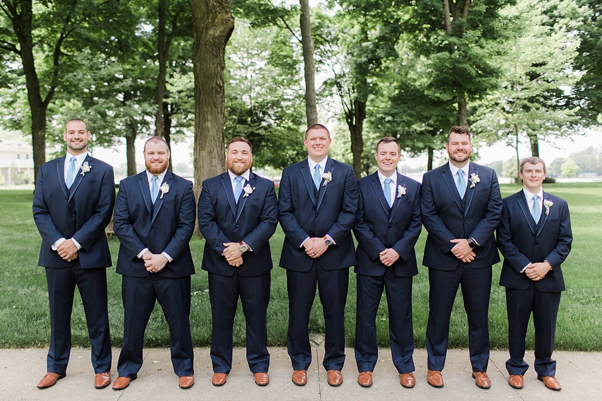 Arielle Peters Photography | Groom and groomsmen under large trees at home on wedding day in Winona Lake, Indiana. 