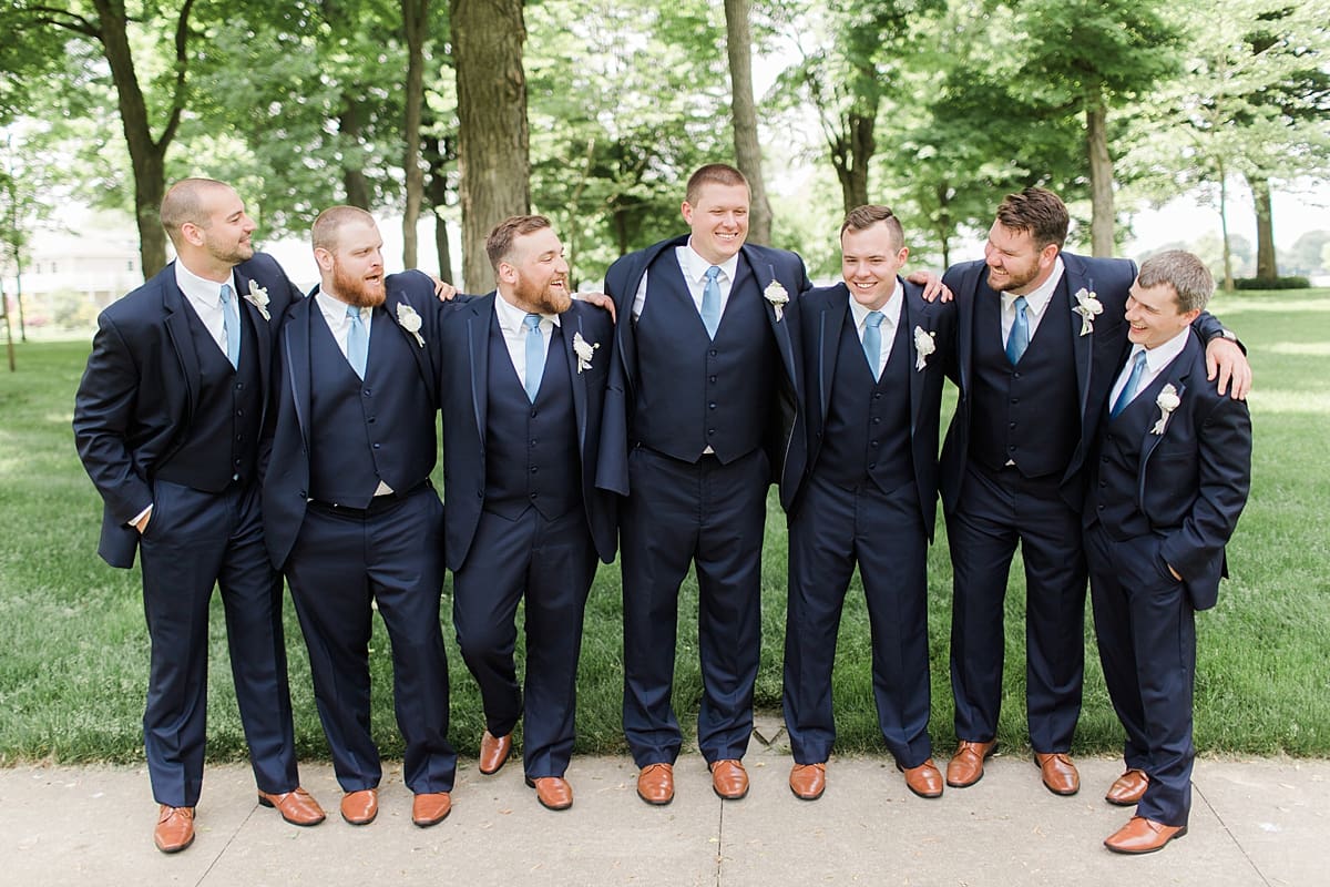 Arielle Peters Photography | Groom and groomsmen under large trees at home on wedding day in Winona Lake, Indiana. 