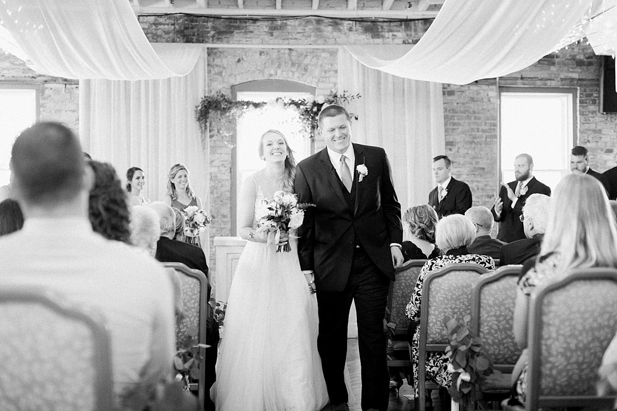 Arielle Peters Photography | Bride and groom walking down the aisle at wedding in Winona Lake, Indiana. 