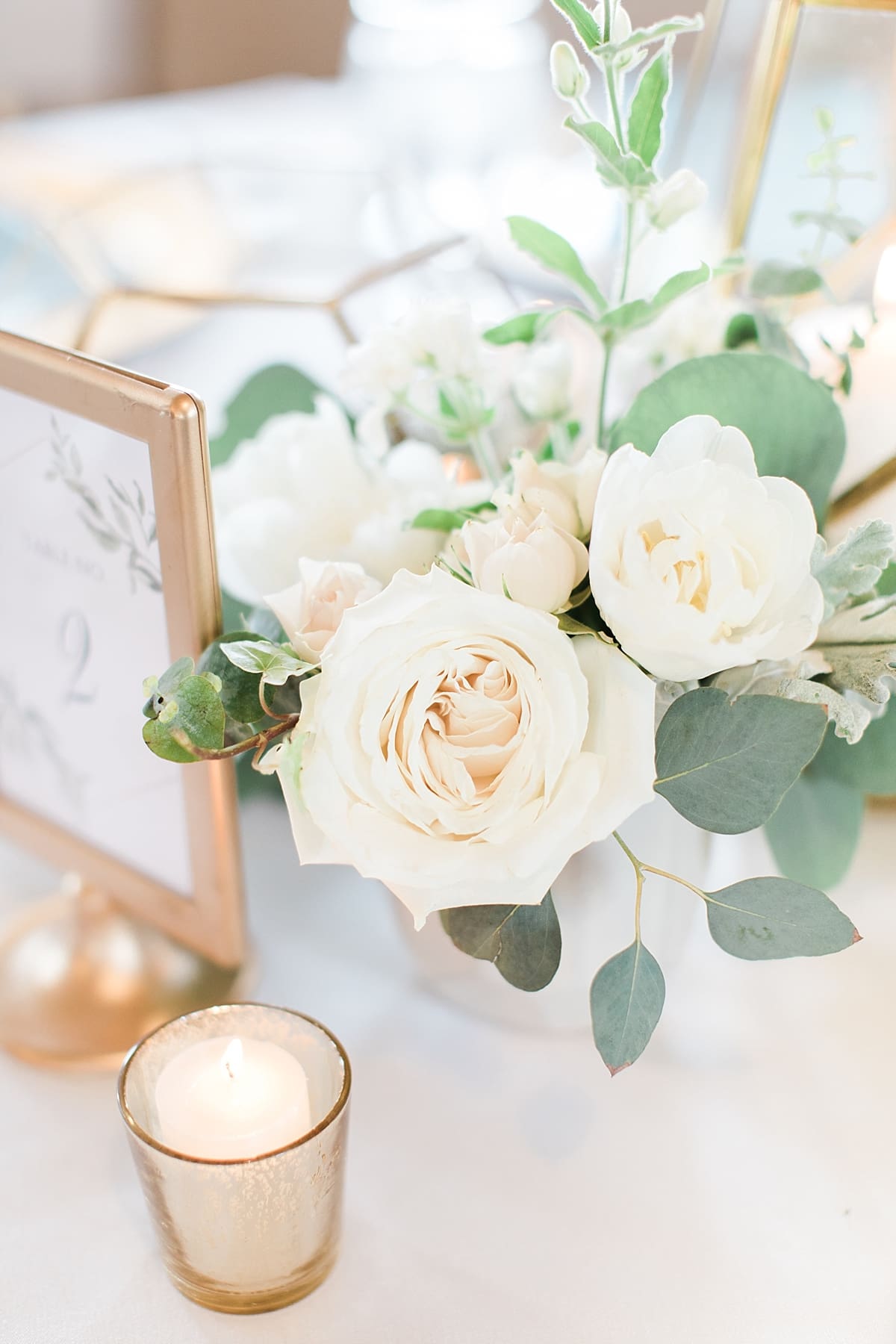 Arielle Peters Photography | Wedding reception table settings and floral arrangements on wedding day at Bread & Chocolate in Goshen, Indiana.