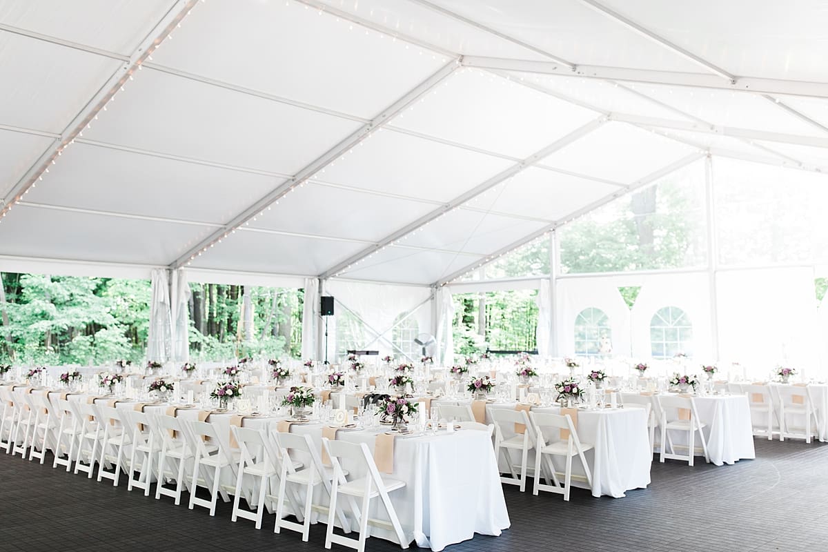  Arielle Peters Photography | Outdoor tent wedding reception table settings and floral arrangements at The Morris Estate in Niles, Michigan.