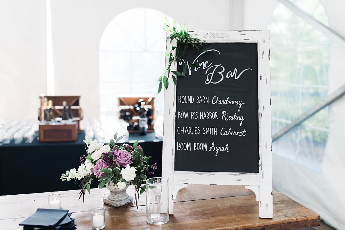  Arielle Peters Photography | Outdoor tent wedding reception table settings and floral arrangements at The Morris Estate in Niles, Michigan.