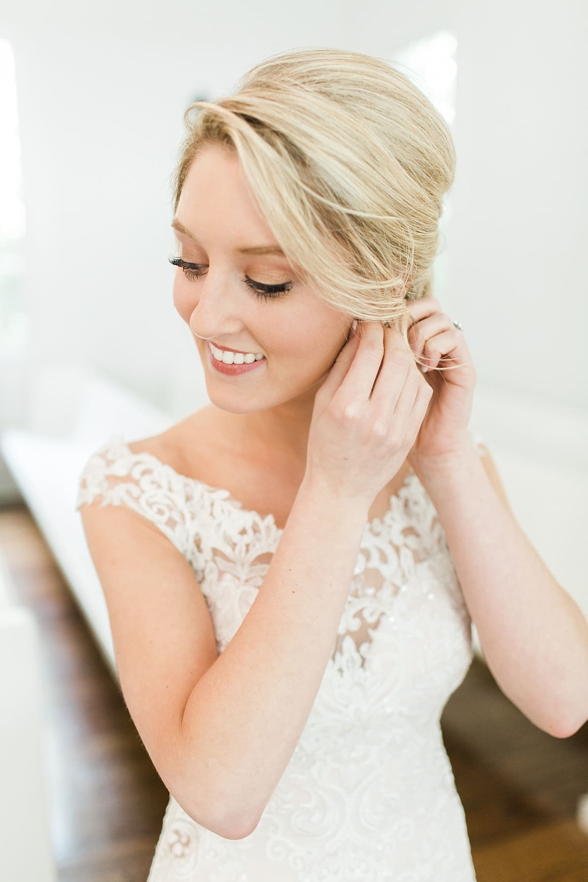 Arielle Peters Photography | Bride putting on wedding day jewelry in church on wedding day at The Morris Estate in Niles, Michigan.