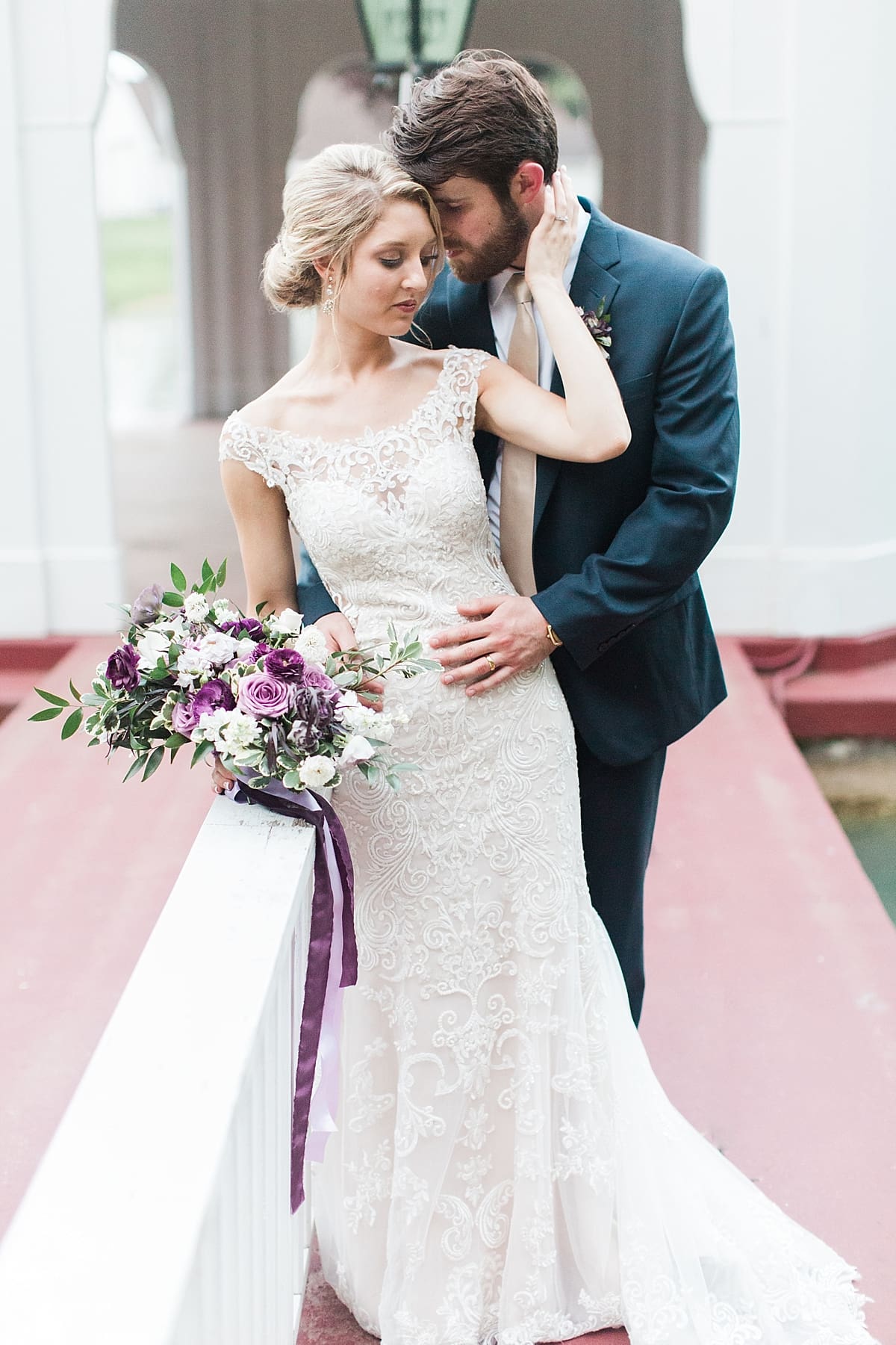  Arielle Peters Photography | Groom holding bride by gazebo on water on wedding day at The Morris Estate in Niles, Michigan.