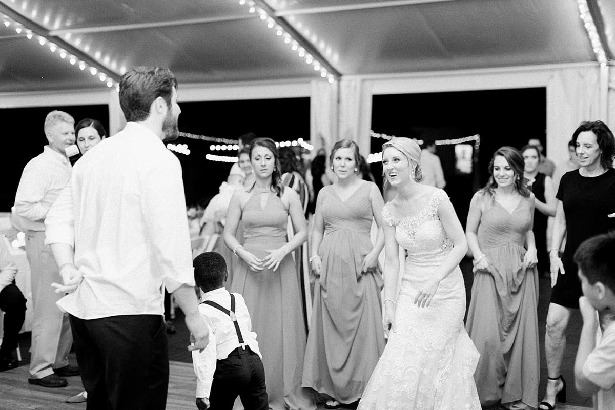  Arielle Peters Photography | Bride and groom dancing at outdoor tent wedding reception on wedding day at The Morris Estate in Niles, Michigan.