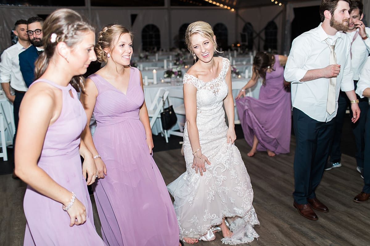  Arielle Peters Photography | Bride and groom dancing at outdoor tent wedding reception on wedding day at The Morris Estate in Niles, Michigan.