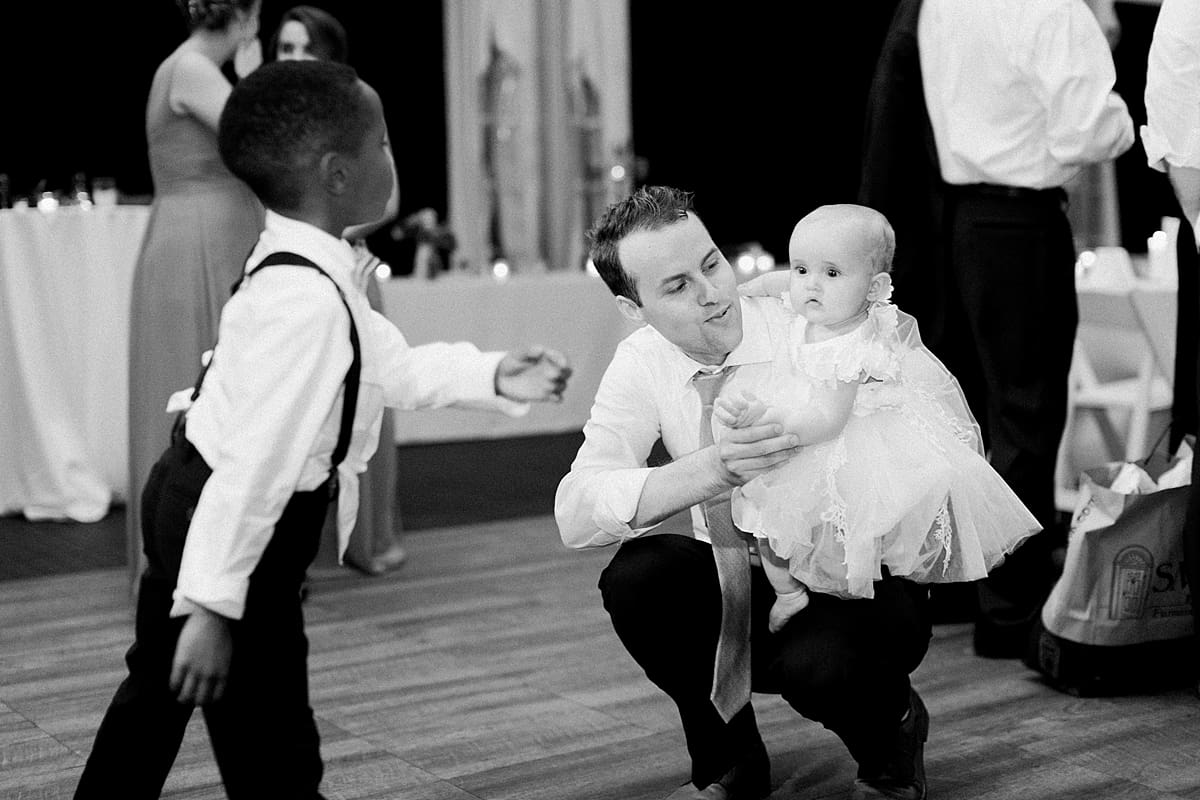  Arielle Peters Photography | Ring bearer dancing at outdoor tent wedding reception on wedding day at The Morris Estate in Niles, Michigan.