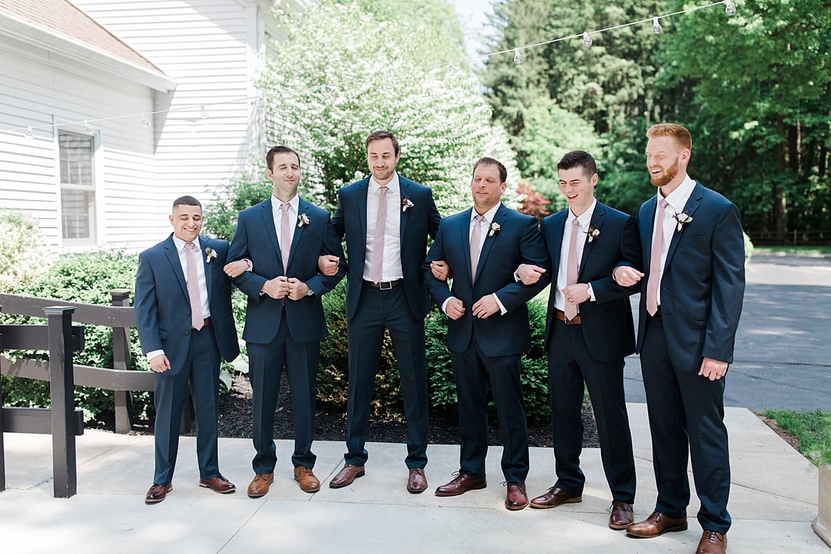  Arielle Peters Photography | Groom and groomsmen doing first reveal on wedding day at The Morris Estate in Niles, Michigan.