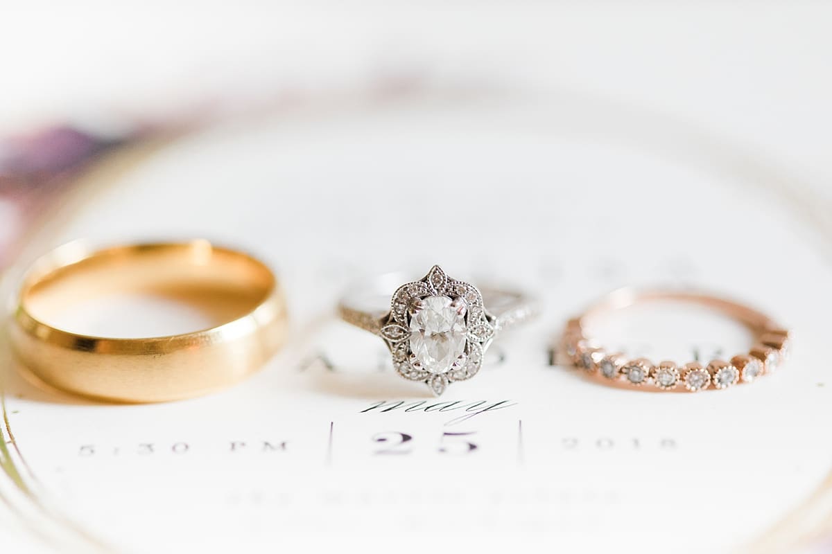Arielle Peters Photography | Wedding rings on invitation on wedding day at The Morris Estate in Niles, Michigan.