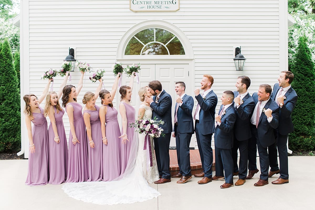 Arielle Peters Photography | Wedding party cheering outside church steeple on wedding day at The Morris Estate in Niles, Michigan.