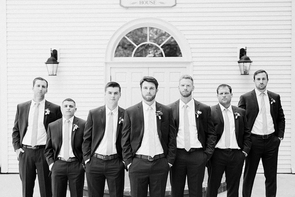  Arielle Peters Photography | Groom and groomsmen outside church steeple on wedding day at The Morris Estate in Niles, Michigan.