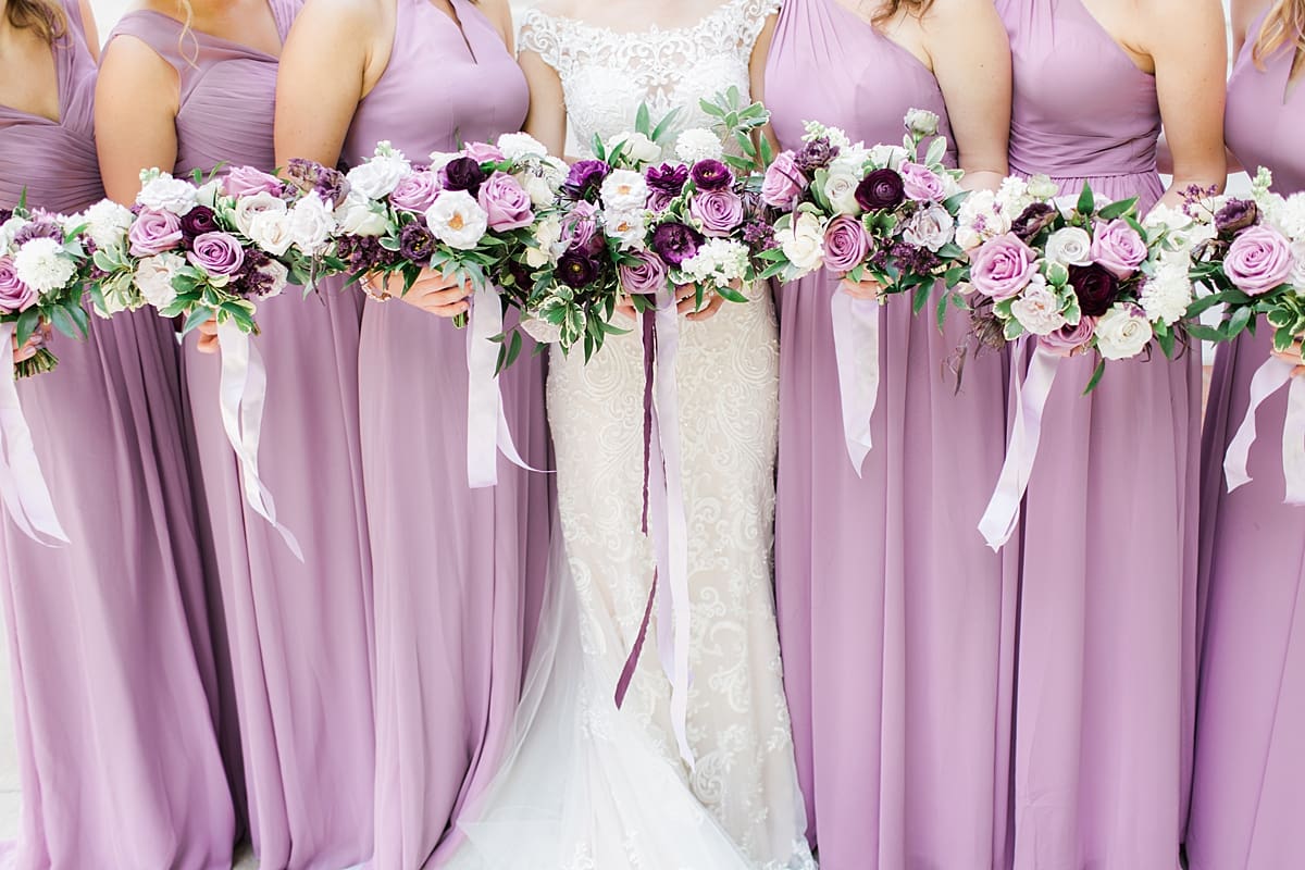  Arielle Peters Photography | Bride and bridesmaids holding bouquets on wedding day at The Morris Estate in Niles, Michigan.