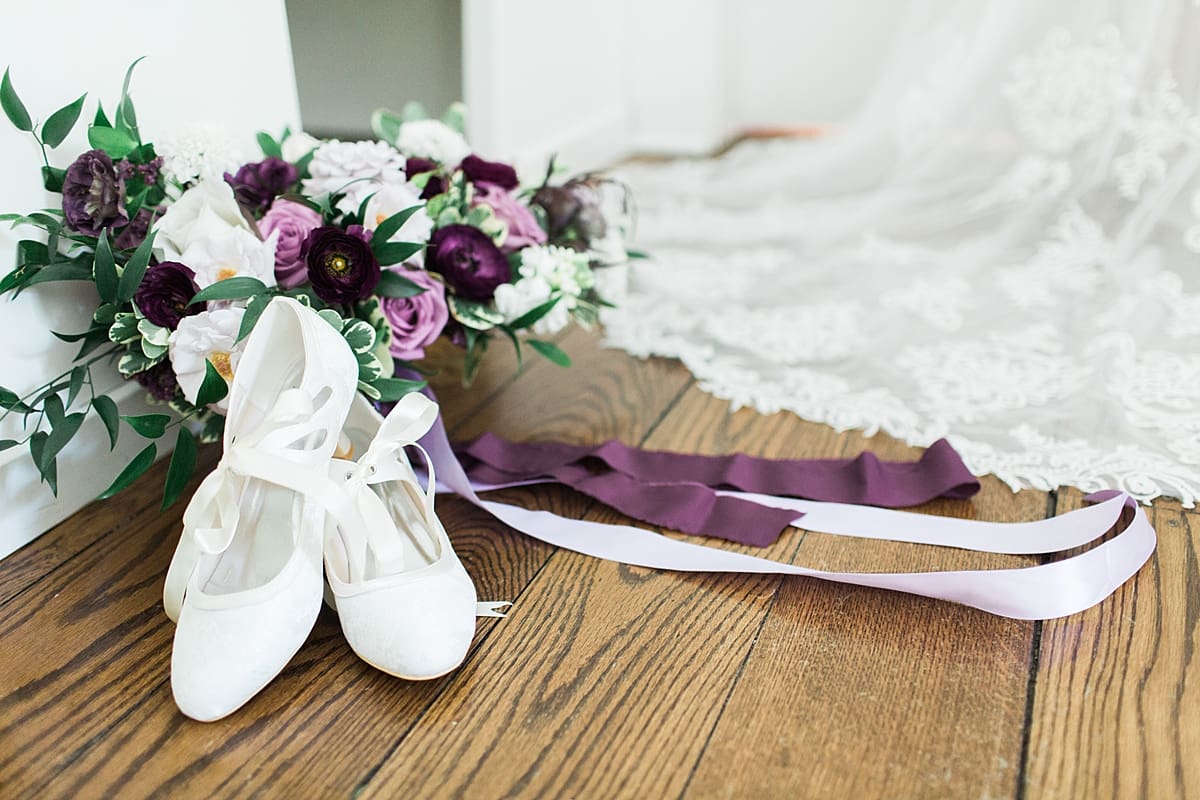 Arielle Peters Photography | Wedding dress shoes and bouquet on wedding day at The Morris Estate in Niles, Michigan.