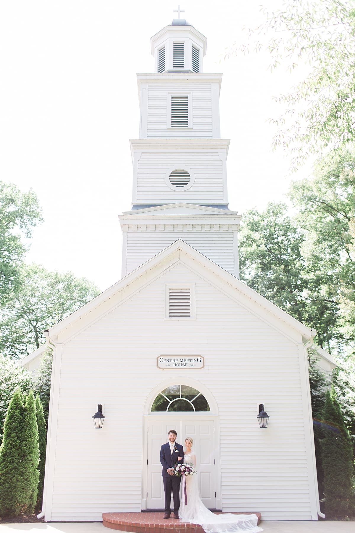  Arielle Peters Photography | Bride and groom standing outside church steeple on wedding day at The Morris Estate in Niles, Michigan.