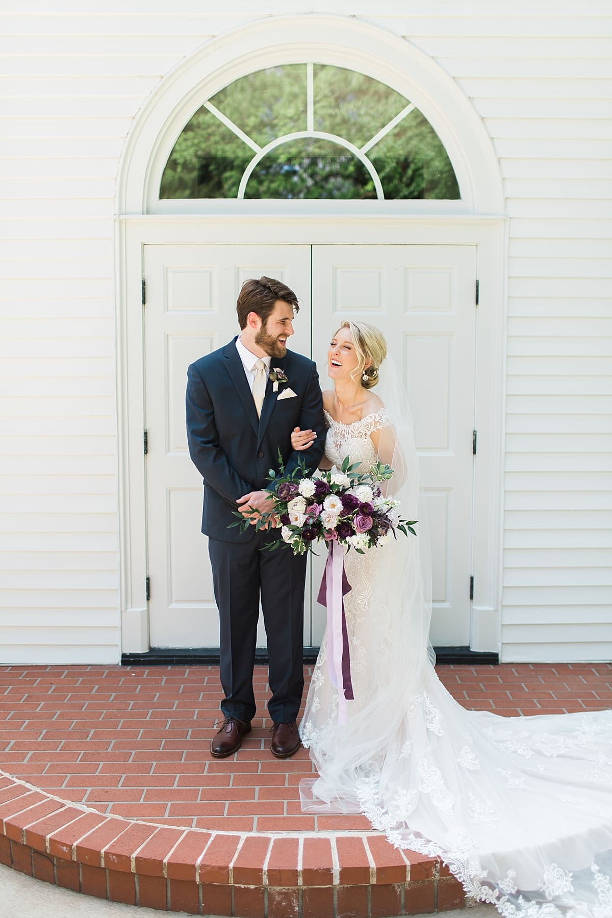  Arielle Peters Photography | Bride and groom in front of french doors on wedding day at The Morris Estate in Niles, Michigan.