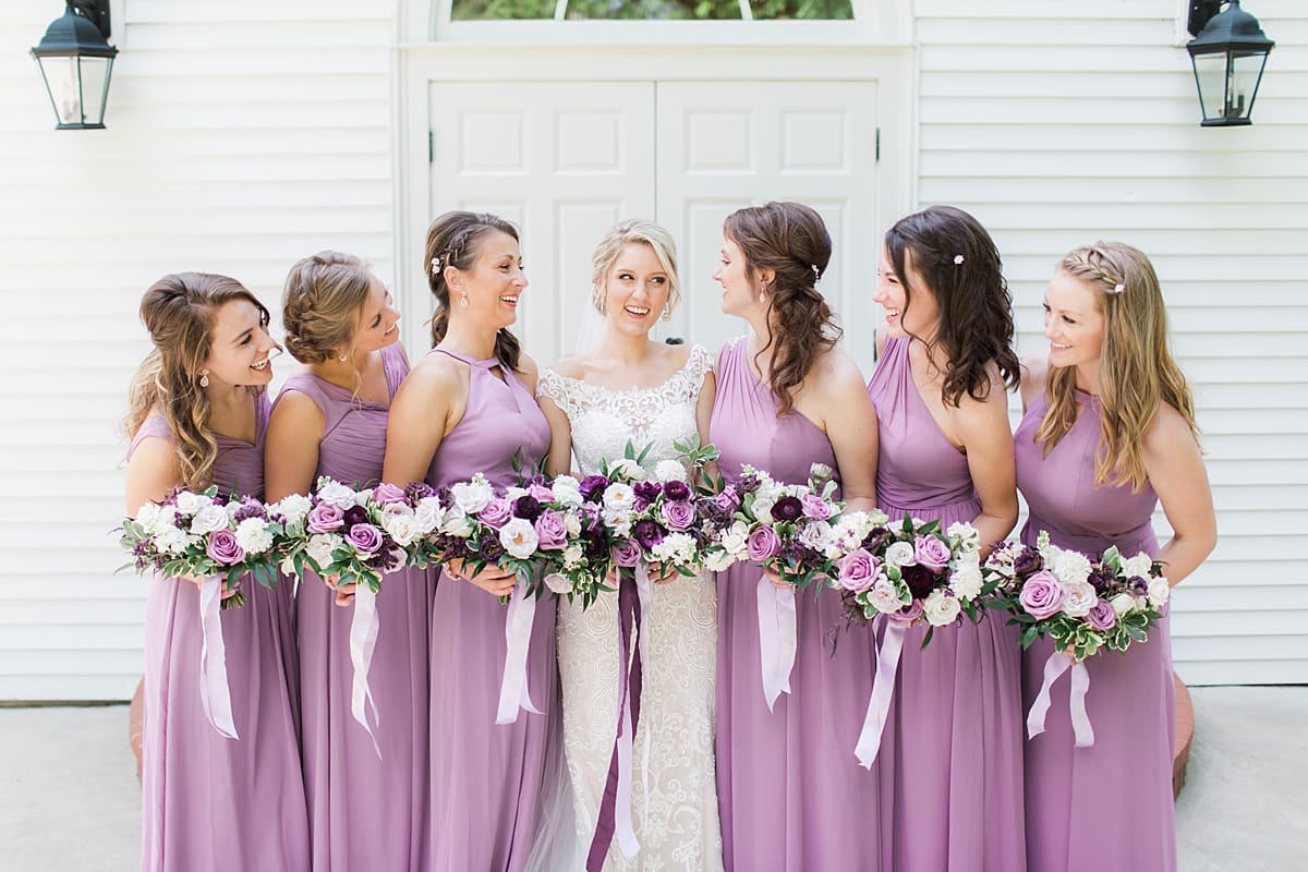  Arielle Peters Photography | Bride and bridesmaids in front of french doors on wedding day at The Morris Estate in Niles, Michigan.