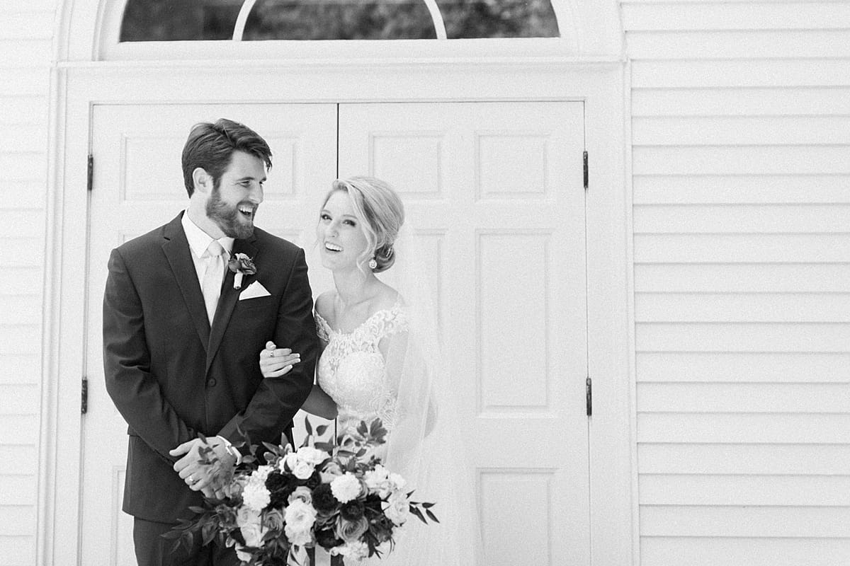  Arielle Peters Photography | Bride and groom in front of french doors on wedding day at The Morris Estate in Niles, Michigan.