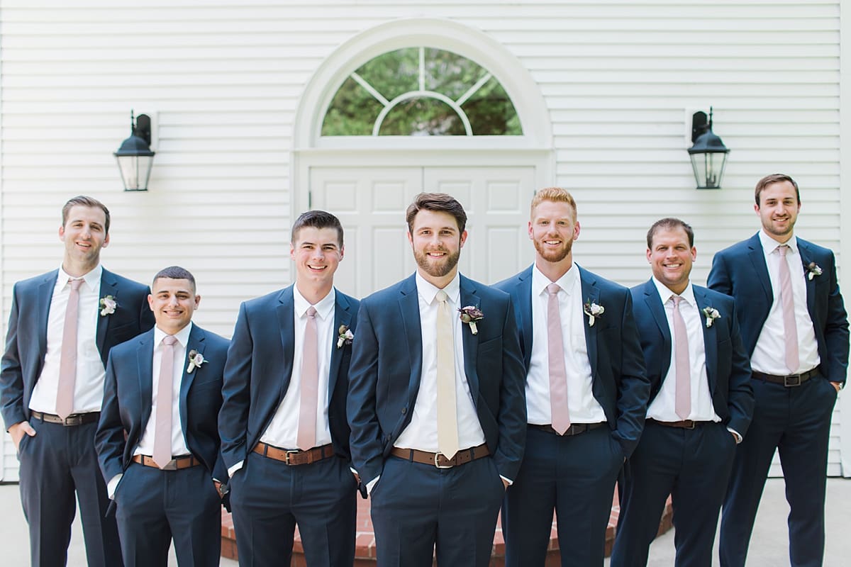  Arielle Peters Photography | Groom and groomsmen in front of french doors on wedding day at The Morris Estate in Niles, Michigan.