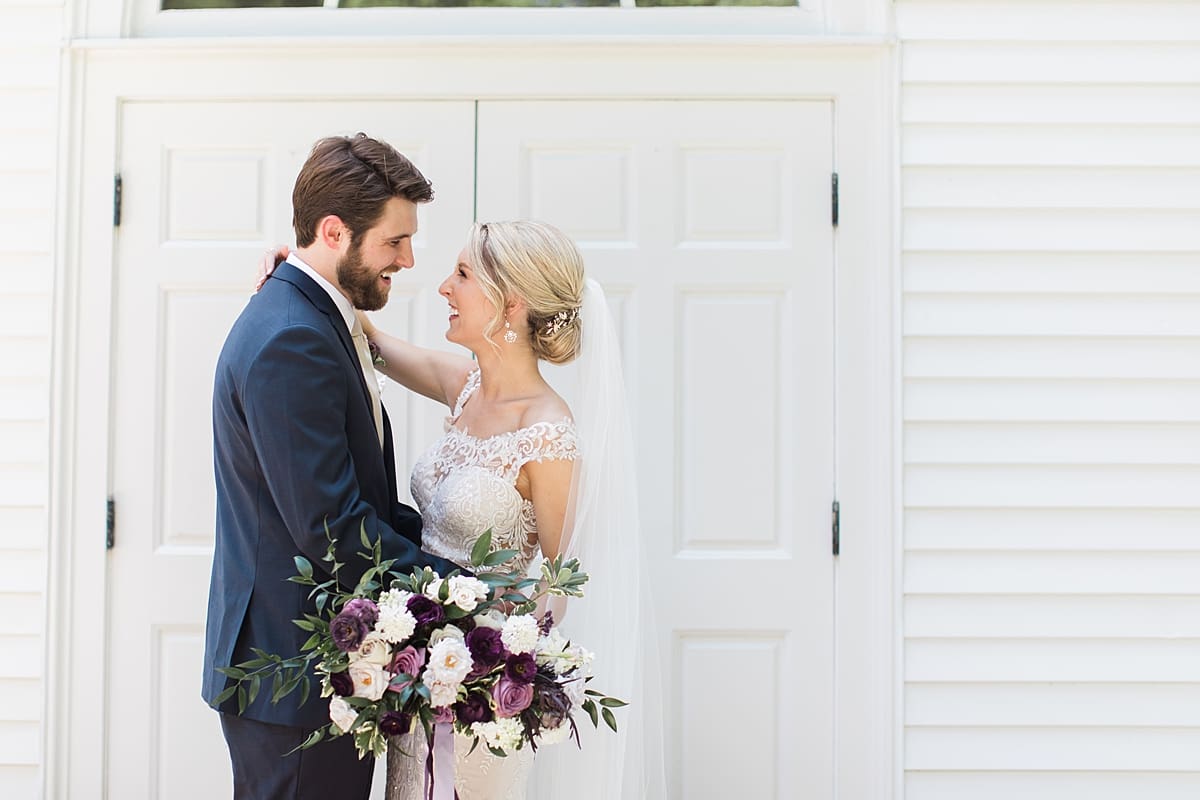  Arielle Peters Photography | Bride and groom in front of french doors on wedding day at The Morris Estate in Niles, Michigan.