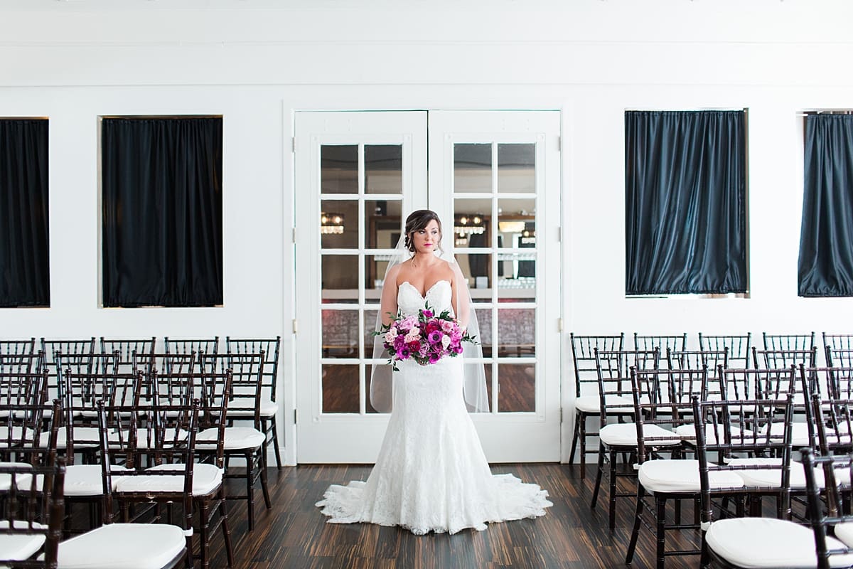 Arielle Peters Photography | Bride in front of french doors at The Allure in LaPorte, Indiana on wedding day.