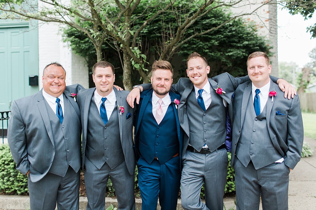 Arielle Peters Photography | Groom and groomsmen in front of turquoise doors at The Allure in LaPorte, Indiana on wedding day.
