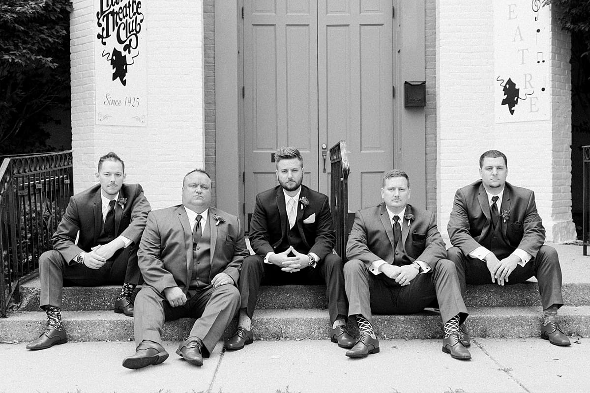 Arielle Peters Photography | Groom and groomsmen in front of turquoise doors at The Allure in LaPorte, Indiana on wedding day.