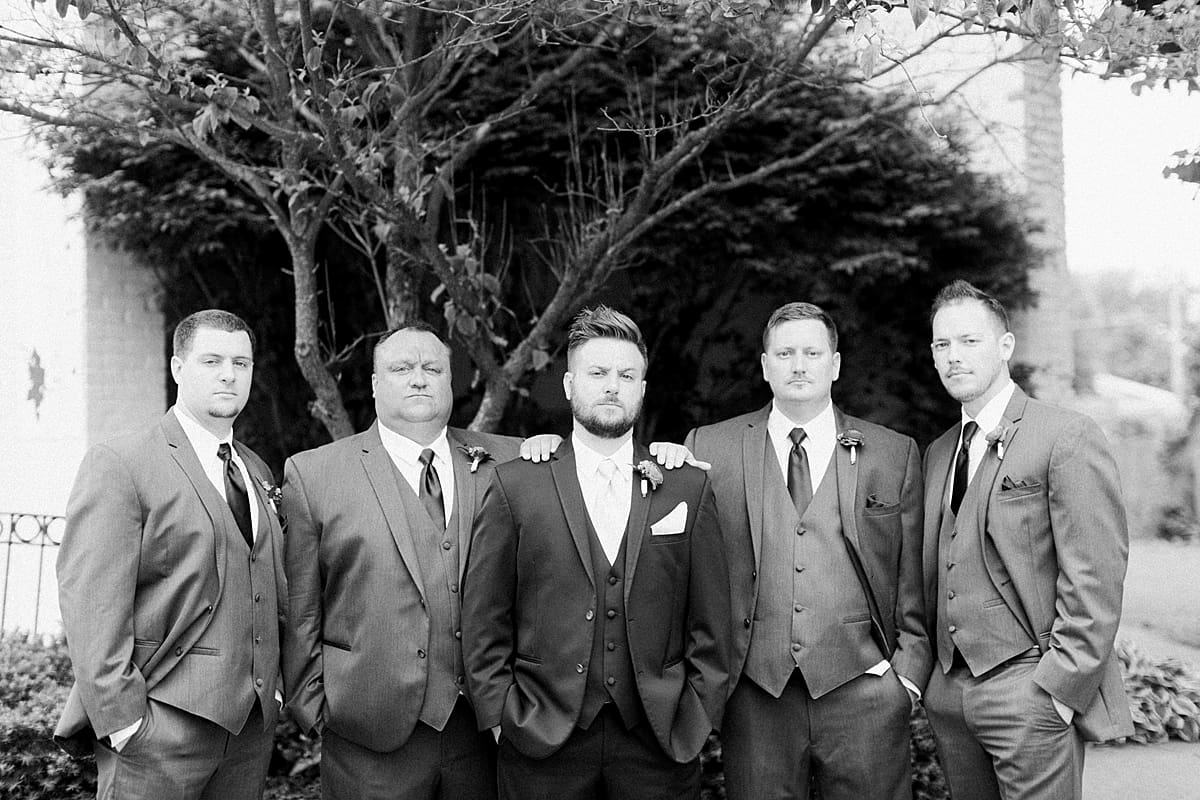 Arielle Peters Photography | Groom and groomsmen with serious faces at The Allure in LaPorte, Indiana on wedding day.