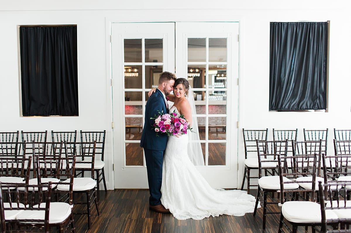 Arielle Peters Photography | Bride and groom in front of french doors at The Allure in LaPorte, Indiana on wedding day.
