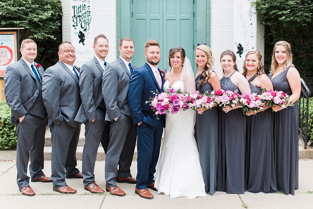 Arielle Peters Photography | Wedding party in front of turquoise doors at The Allure in LaPorte, Indiana on wedding day.