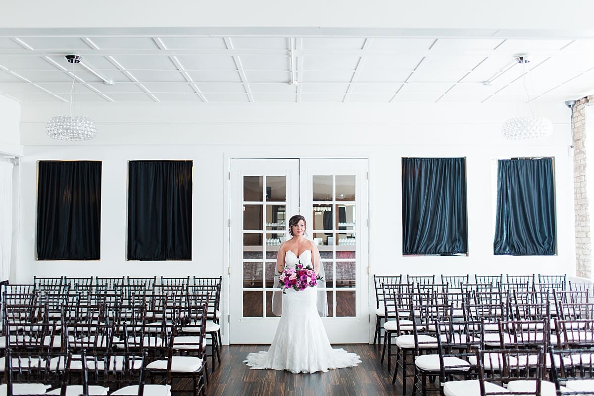 Arielle Peters Photography | Bride standing in front of french doors at The Allure in LaPorte, Indiana on wedding day.