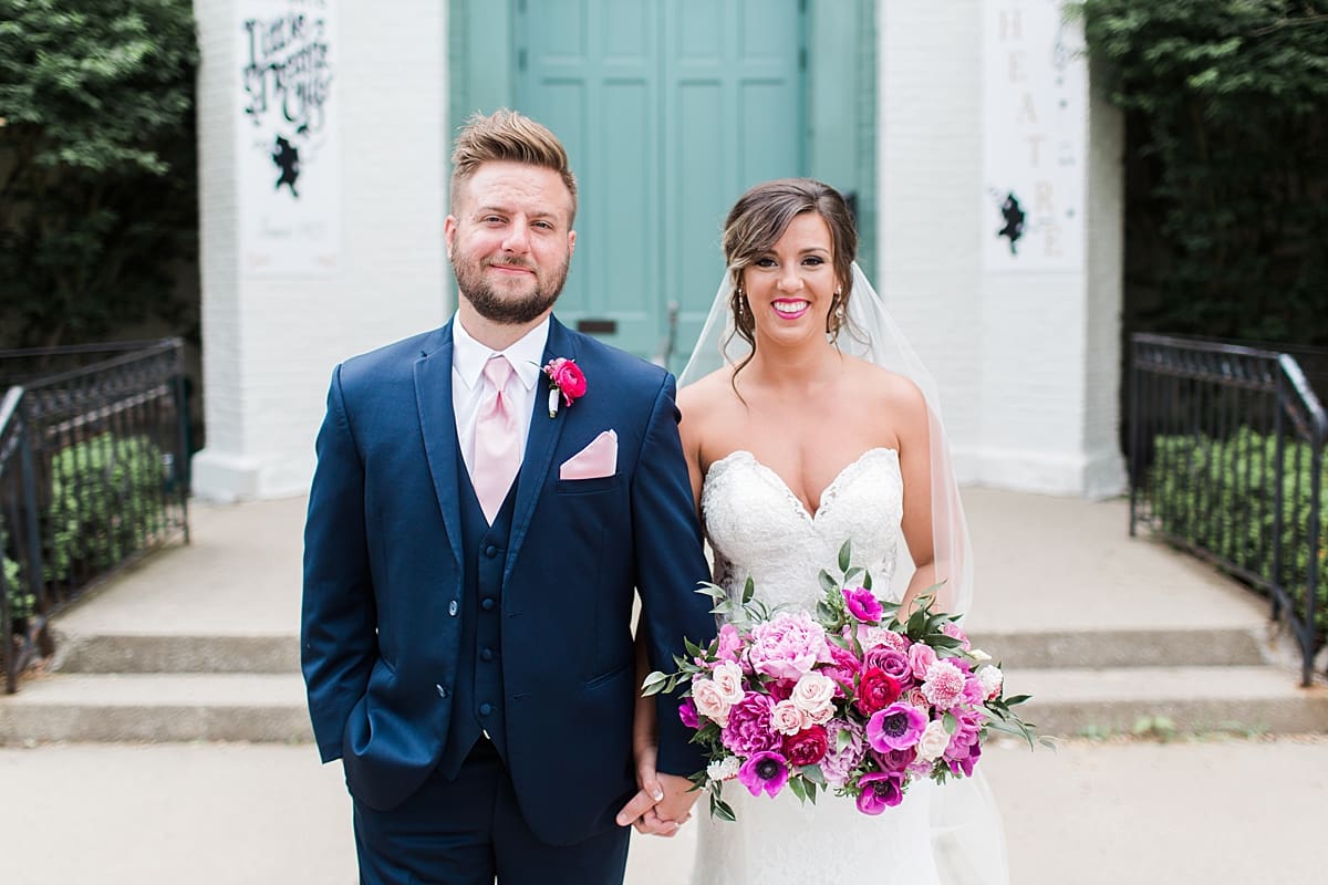 Arielle Peters Photography | Bride and groom holding hands in front of turquoise doors at The Allure in LaPorte, Indiana on wedding day.