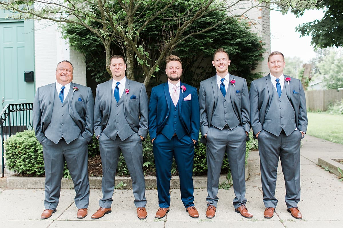 Arielle Peters Photography | Groom and groomsmen in front of turquoise doors at The Allure in LaPorte, Indiana on wedding day.