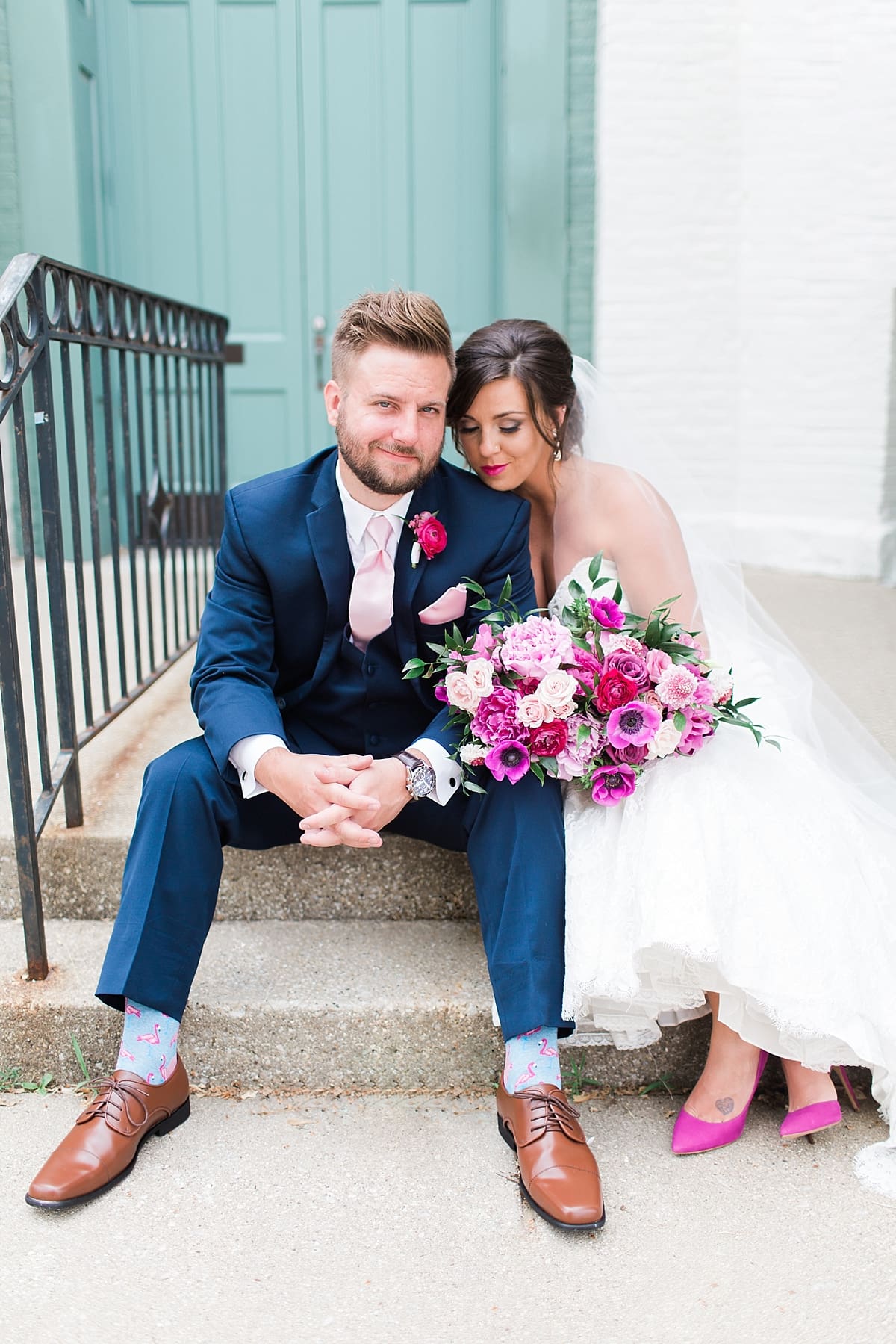 Arielle Peters Photography | Bride and groom sitting in front of turquoise doors at The Allure in LaPorte, Indiana on wedding day.
