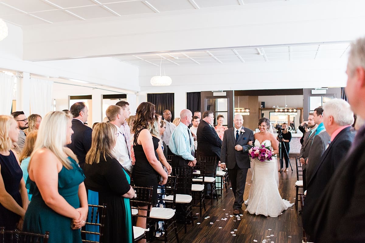 Arielle Peters Photography | Father of bride walking bride down aisle during wedding at The Allure in LaPorte, Indiana on wedding day.