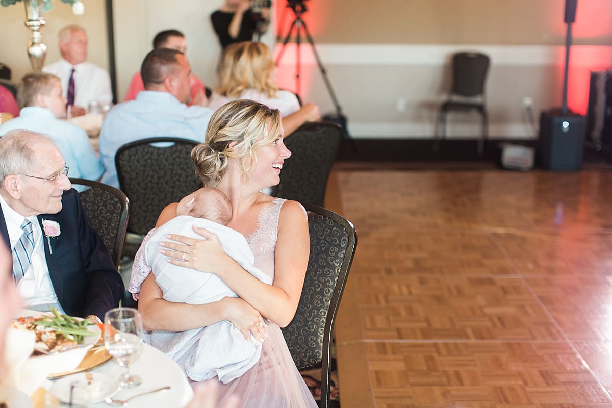 Arielle Peters Photography | Wedding guests laughing at wedding reception on wedding day at Morris Park Country Club in South Bend, Indiana.